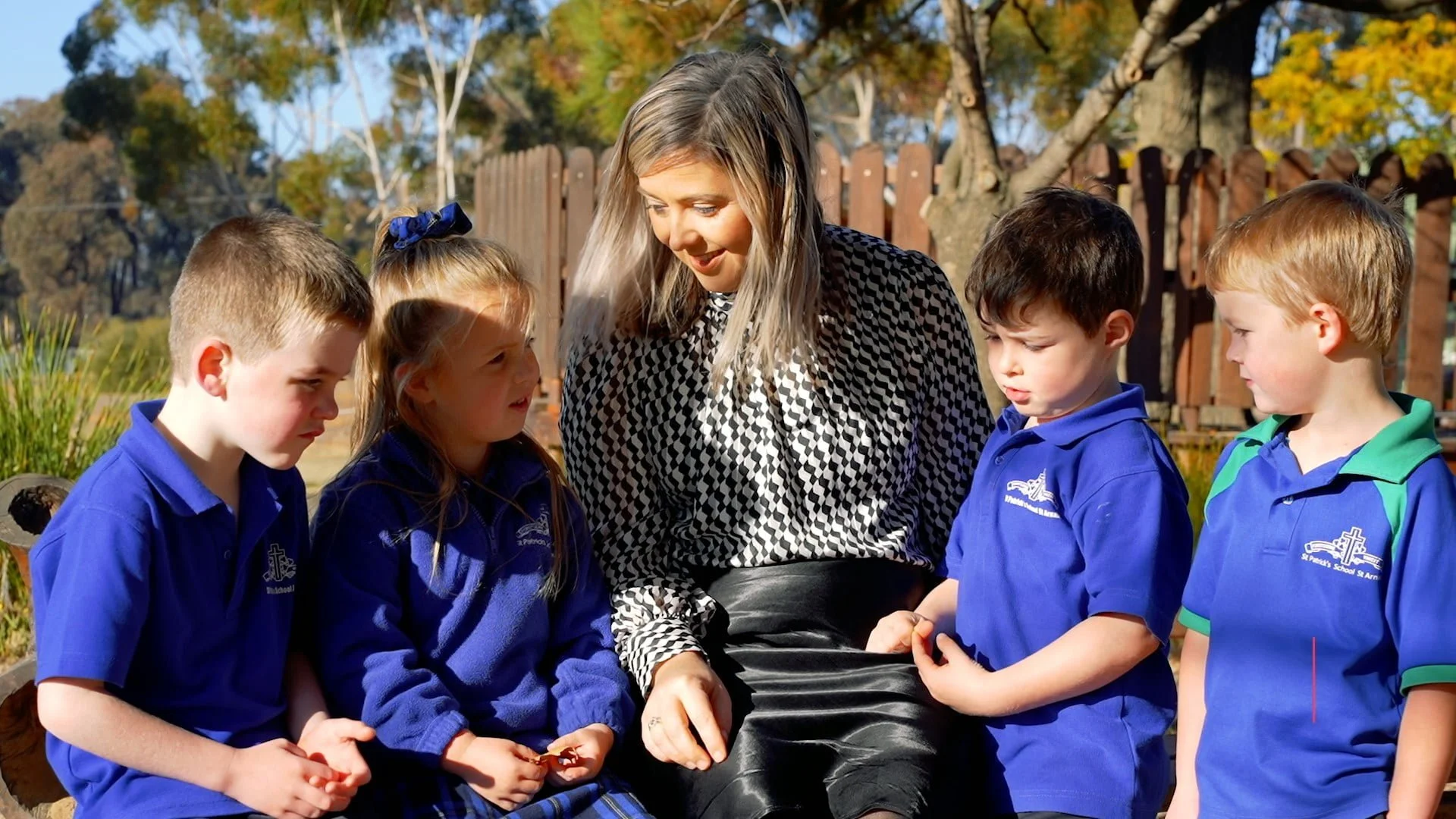 A teacher with students outdoors at St Patrick's St Arnaud